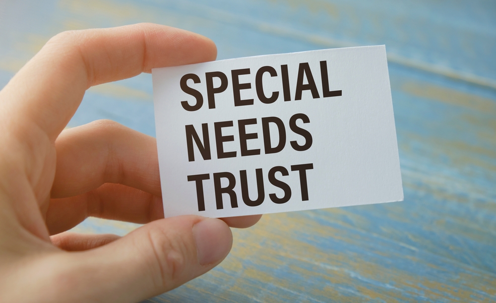 Businessman,Holding,A,Card,With,Special,Needs,Plan,Message